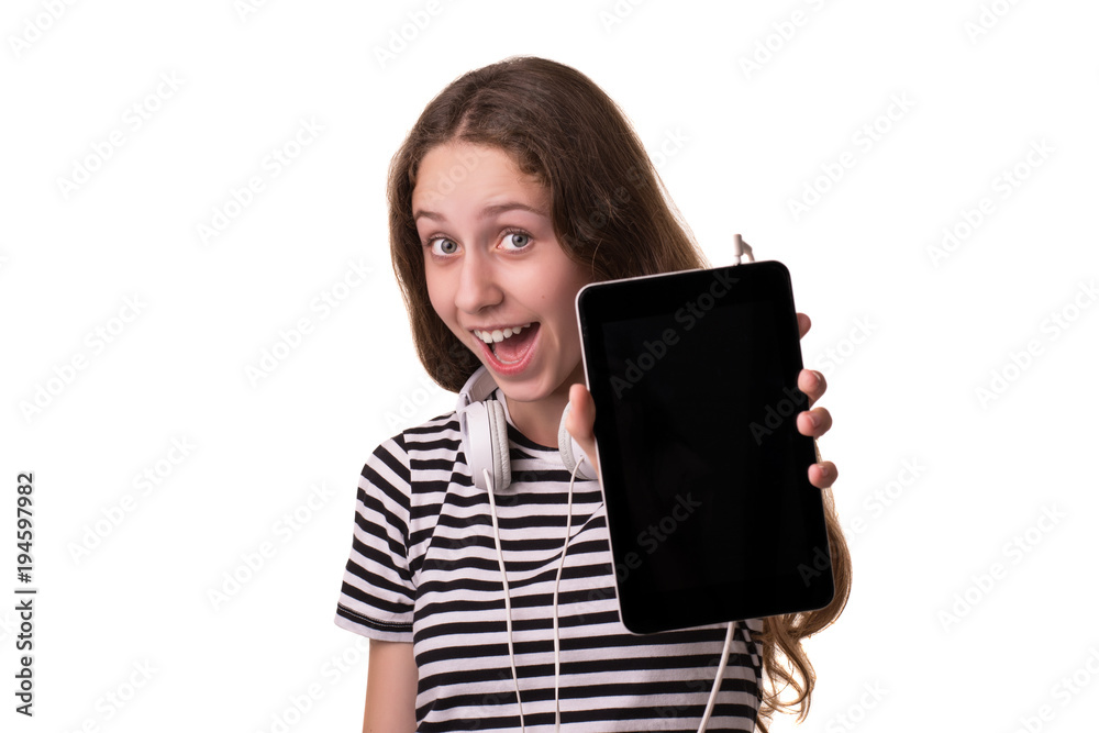 Photo of a young cheerful girl, isolated on white background. Looking at the camera showing the display of the tablet computer. Photo of a young cheerful girl, isolated on white background. Looking at the camera showing the display of the tablet computer.