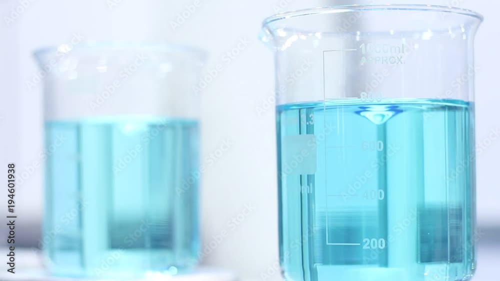 Bottle And Liquid Nitrogen In A Laboratory. Chemical Experiment. Flask With Bottle And Liquid Nitrogen In A Laboratory. Chemical Experiment. Flask With