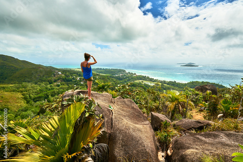 Fototapeta Adventure woman hiking on chenard mountain, praslin, seychelles