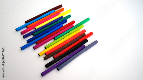 multi-colored felt-tip pens on the white isolated background, 18 colors.