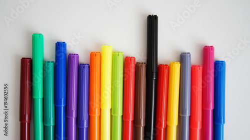 multi-colored felt-tip pens on the white isolated background, 18 colors.