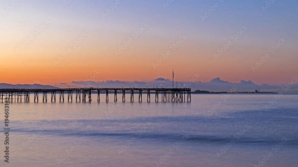 Beach pier at sunrise at Ventura harbor Beach pier at sunrise at Ventura harbor