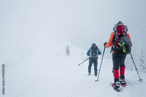 People with backpacks in winter Gorgany mountains