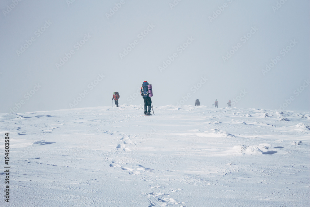 Team of mountaineers reaching the top of Gorgany mountains