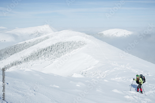 Climber walking in snowy Gorgany mountains
