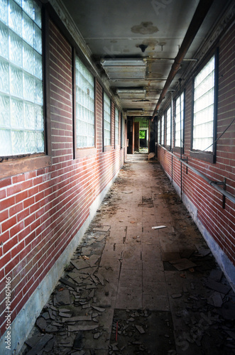 Abandoned brick building with peeling paint 