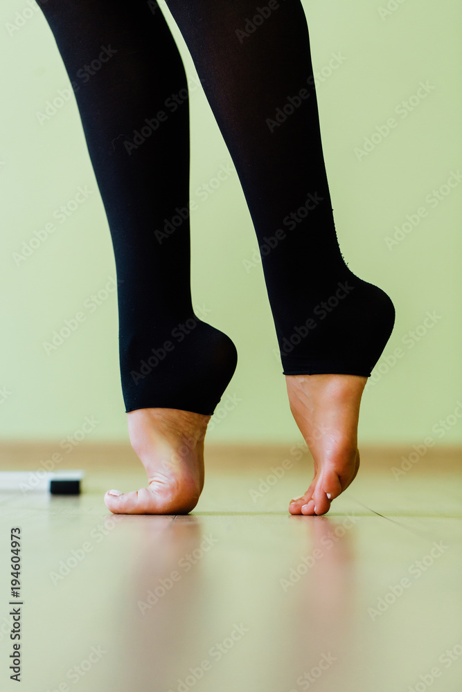 Leg of a ballet dancer. Beautiful graceful legs. Rehearsal of the dance on tiptoe. close-up, Leg of a ballet dancer. Beautiful graceful legs. Rehearsal of the dance on tiptoe. close-up,