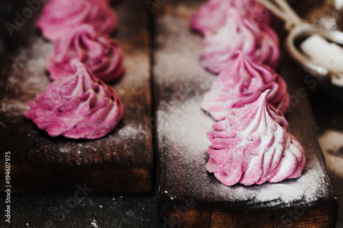 Pink homemade zephyr or marshmallow on dark background