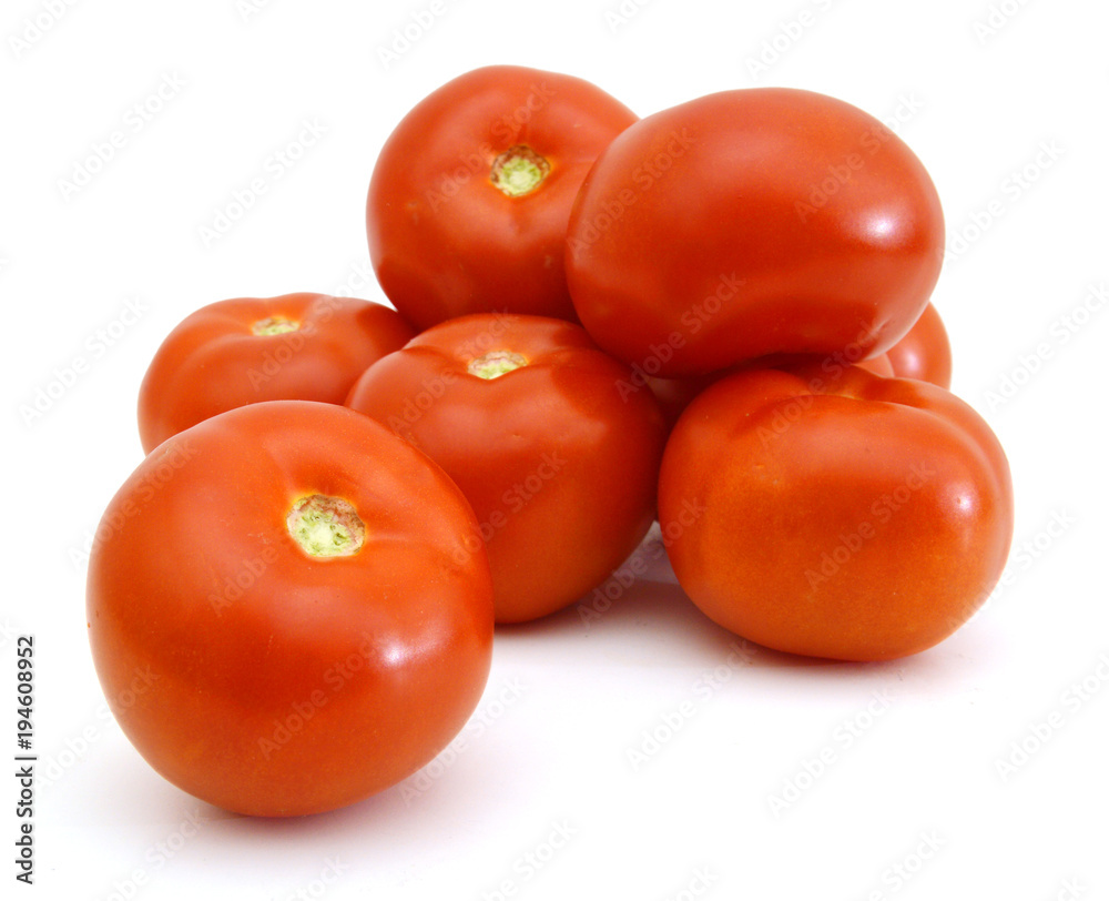 Closeup of tomatoes on the vine isolated on white Closeup of tomatoes on the vine isolated on white