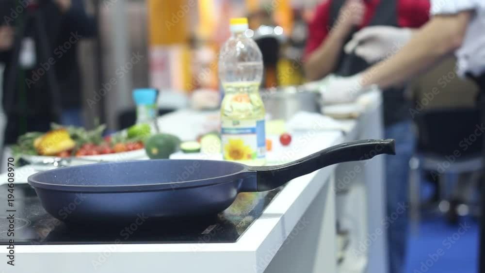 Professional chef preparing a pizza in a modern Italian restaurant. Professional chefs work in a modern kitchen with fresh meat and vegetables. Professional chef preparing a pizza in a modern Italian restaurant. Professional chefs work in a modern kitchen with fresh meat and vegetables.