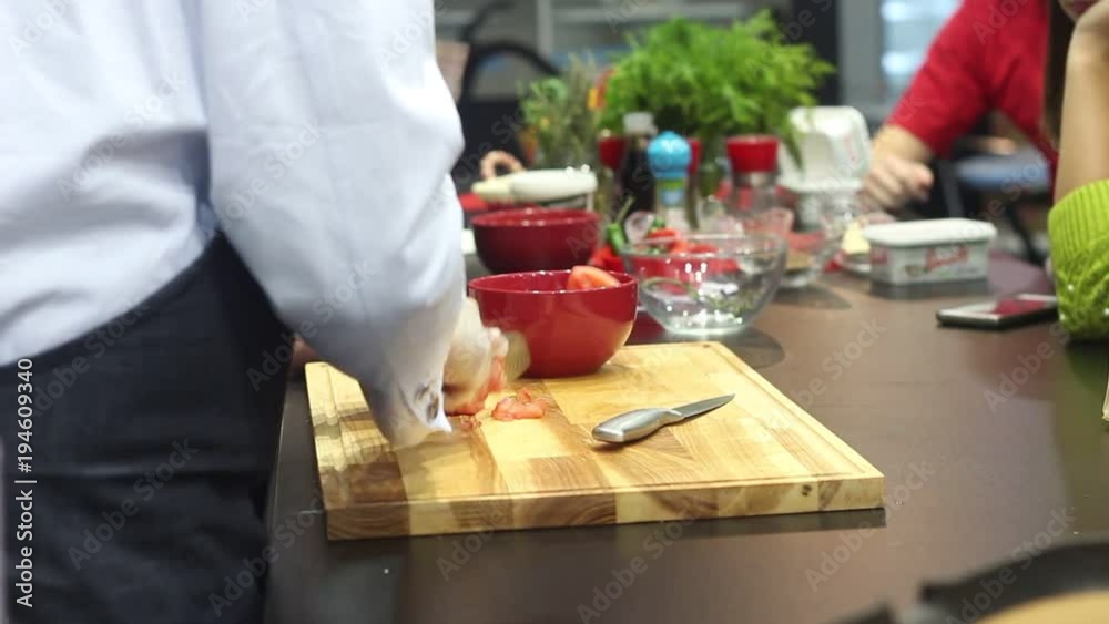 Professional chef preparing a pizza in a modern Italian restaurant. Professional chefs work in a modern kitchen with fresh meat and vegetables. Professional chef preparing a pizza in a modern Italian restaurant. Professional chefs work in a modern kitchen with fresh meat and vegetables.