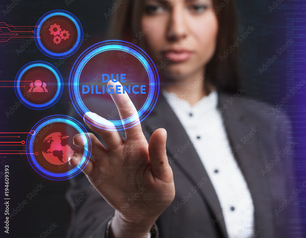The concept of business, technology, the Internet and the network. A young entrepreneur working on a virtual screen of the future and sees the inscription: Due diligence The concept of business, technology, the Internet and the network. A young entrepreneur working on a virtual screen of the future and sees the inscription: Due diligence