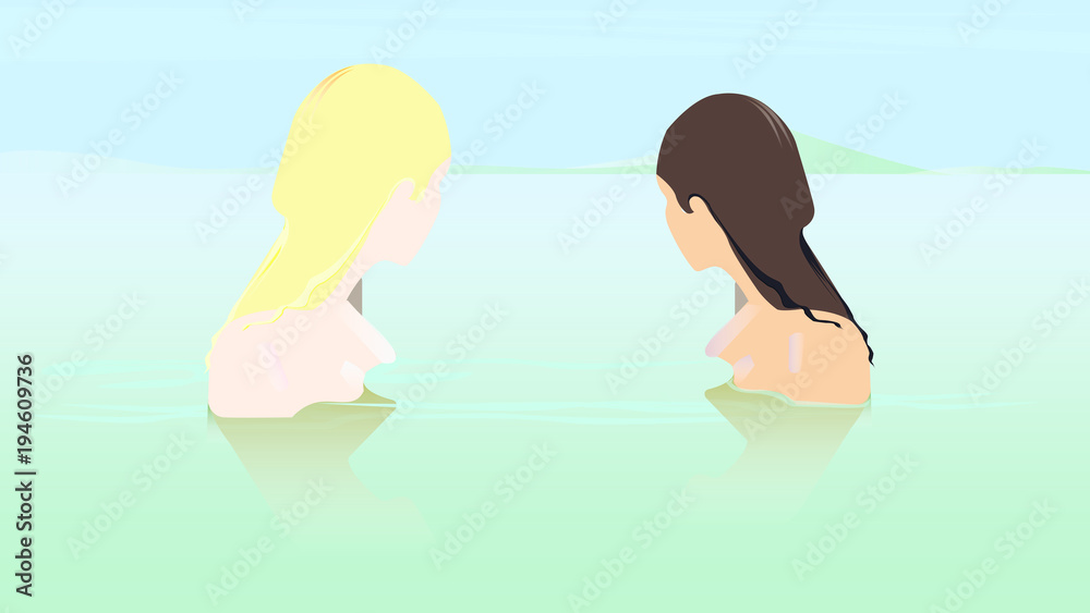 Due ragazze che si godono il tempo libero nuotando in acqua