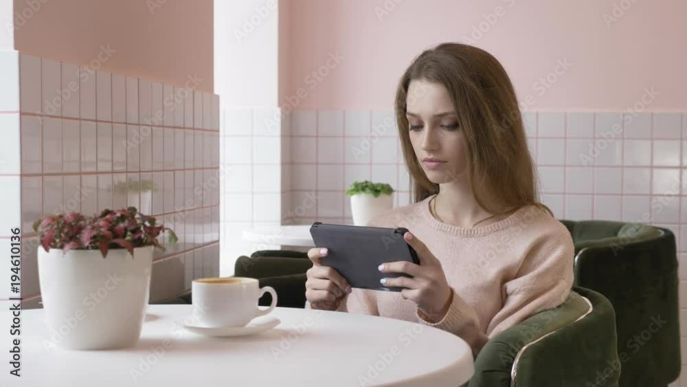Elegant beautiful caucasian woman using tablet, texting, typing. Smiling, looking away 60 fps Elegant beautiful caucasian woman using tablet, texting, typing. Smiling, looking away 60 fps