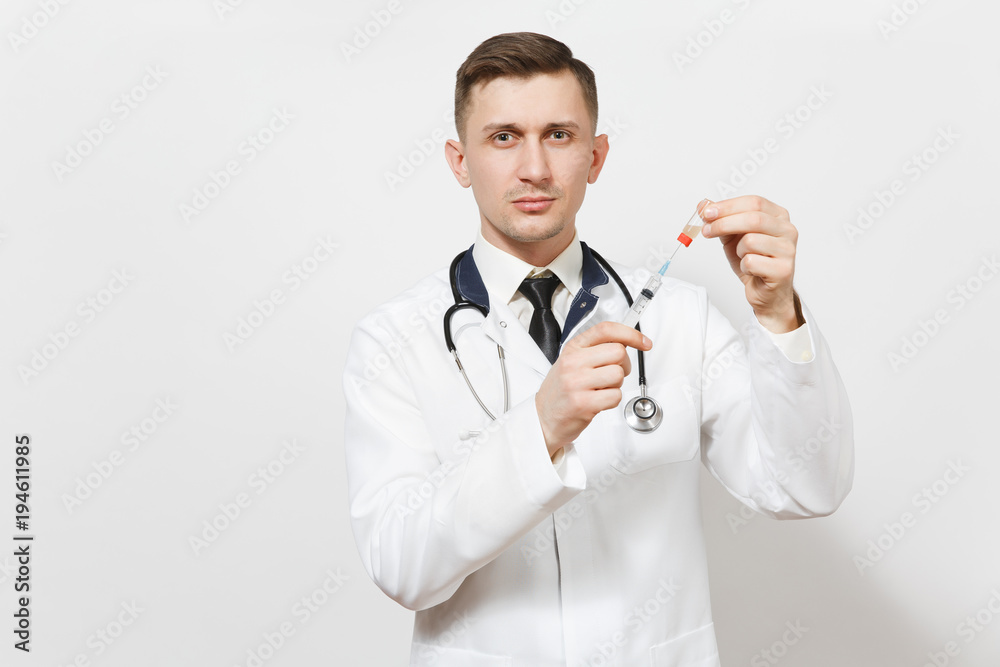 Serious young doctor man isolated on white background. Male doctor in medical uniform, stethoscope draws liquid medicine from bottle with syringe with needle. Healthcare personnel, medicine concept. Serious young doctor man isolated on white background. Male doctor in medical uniform, stethoscope draws liquid medicine from bottle with syringe with needle. Healthcare personnel, medicine concept.