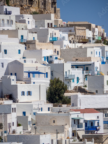 Chora of Astypapaia island ,Greece at daytime a close up of the white houses with the colorful windows © George