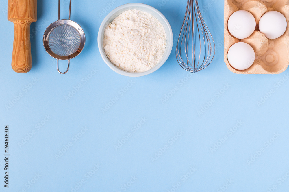 Ingredients for baking on a blue background. Ingredients for baking on a blue background.