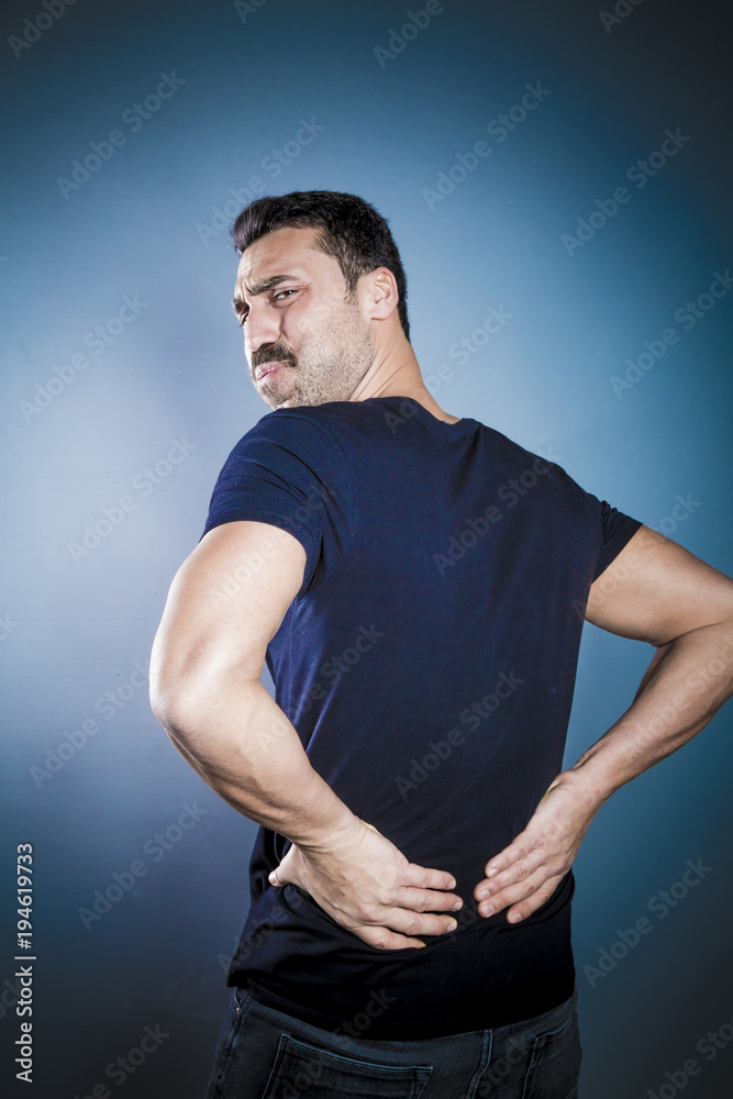 Young handsome man having back problems Young handsome man having back problems