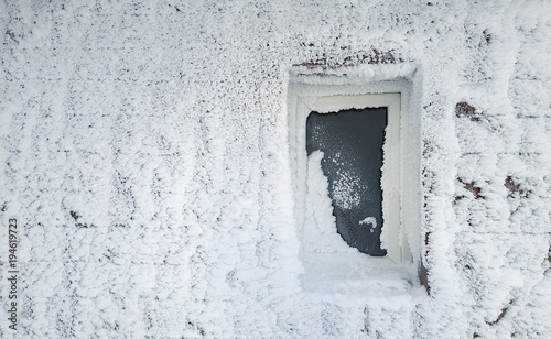 frozen window of house in winter scene © Ioan Panaite