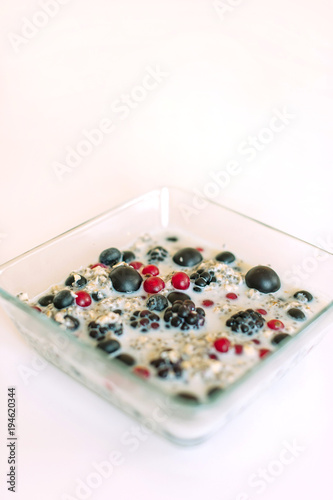 Close-up picture of bowl with cereal porridge and fruits.