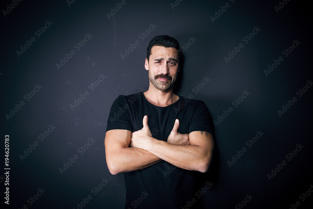 Young handsome man with beard and mustache studio portrait