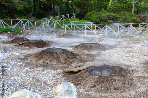 Natural hot mud cauldrons at the crater lake of Lagoa das Furnas are used for cooking famous Cozido das Furnas, Sao Miguel Island, Azores, Portugal photo
