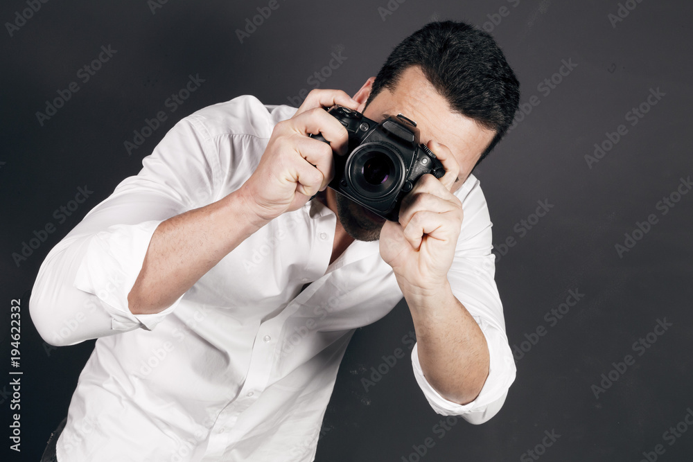 Young handsome photographer with beard and mustache studio portrait Young handsome photographer with beard and mustache studio portrait