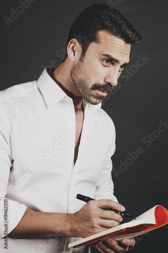 Young handsome man with beard and mustache studio portrait