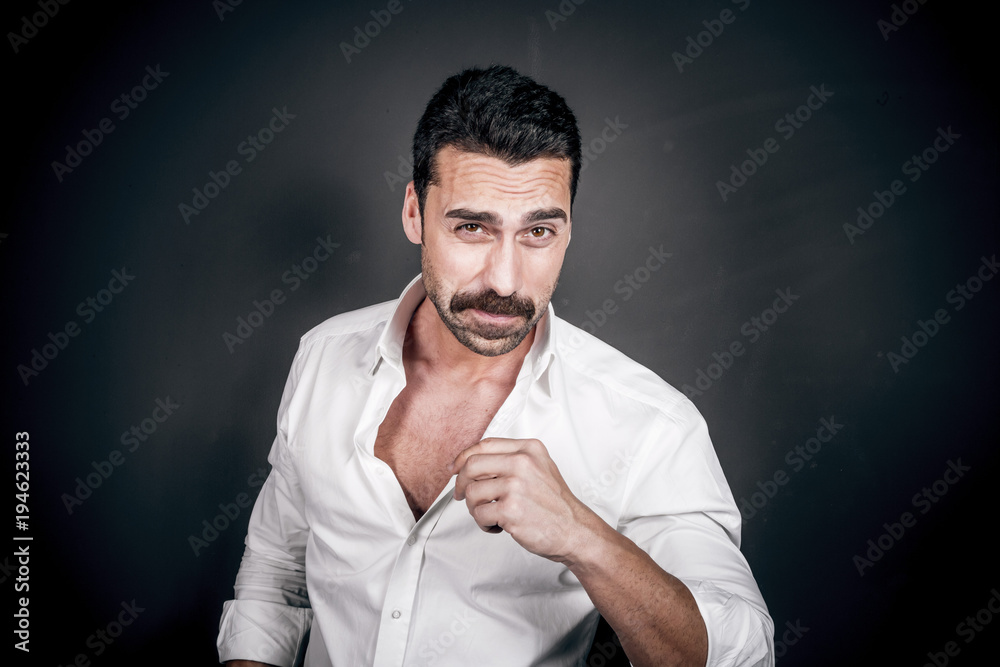 Young handsome man with beard and mustache studio portrait Young handsome man with beard and mustache studio portrait