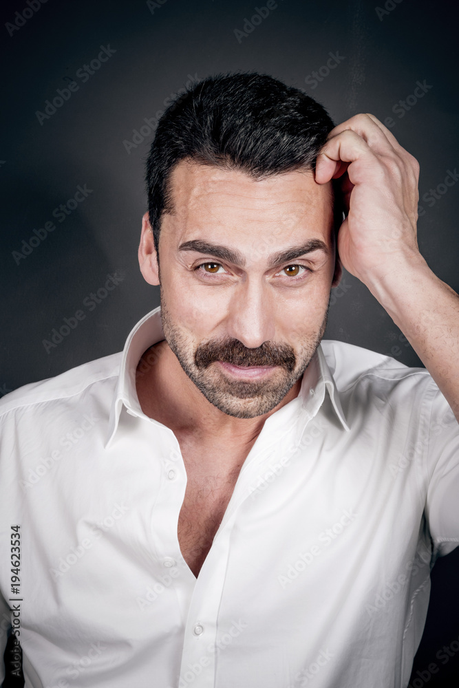 Young handsome man with beard and mustache studio portrait Young handsome man with beard and mustache studio portrait
