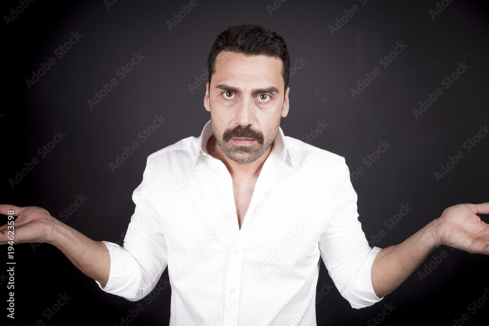 Young handsome man with beard and mustache studio portrait Young handsome man with beard and mustache studio portrait