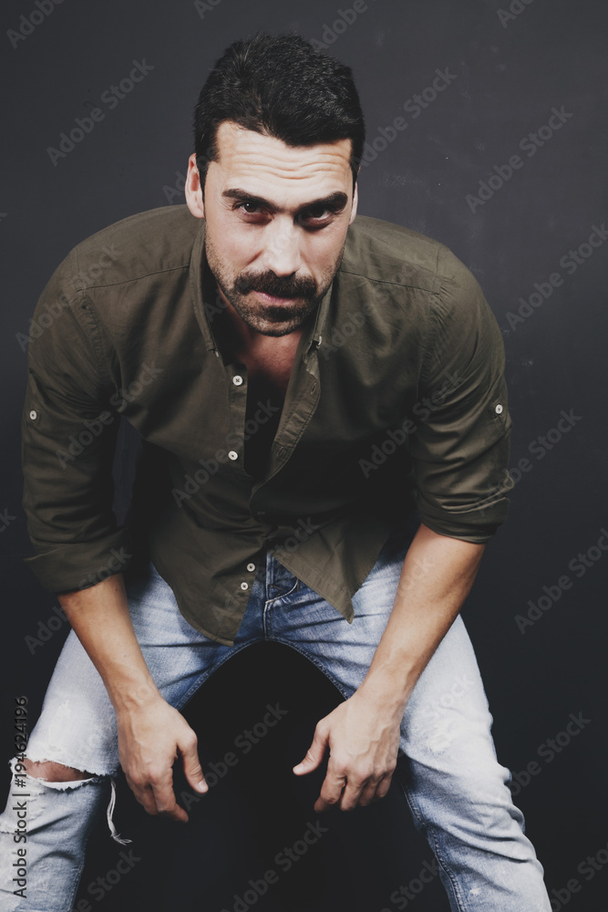Young handsome man with beard and mustache studio portrait Young handsome man with beard and mustache studio portrait
