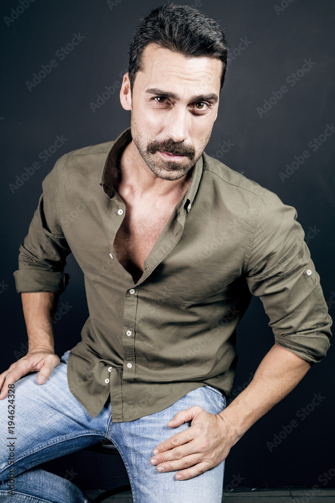 Young handsome man with beard and mustache studio portrait Young handsome man with beard and mustache studio portrait