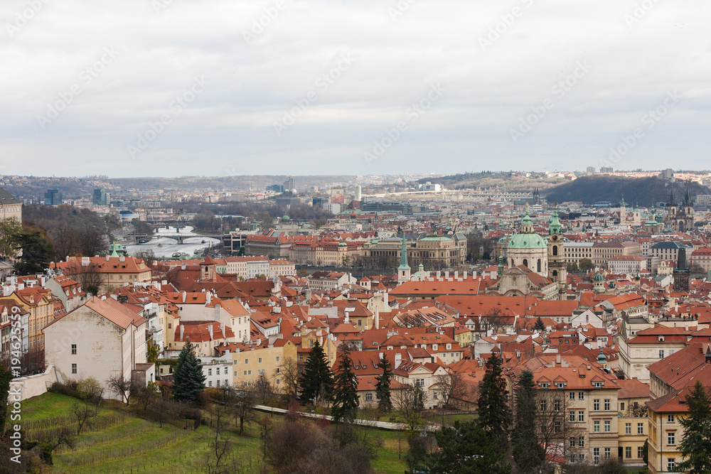 View of Prague city from hill. Traditional red roofs in old town.