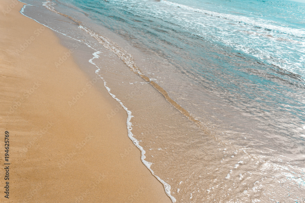 The beach on a Sunny summer day near the sea The beach on a Sunny summer day near the sea