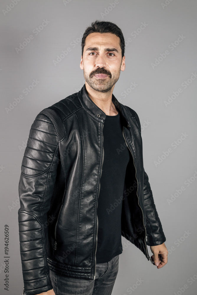 Young handsome man with beard and mustache studio portrait Young handsome man with beard and mustache studio portrait