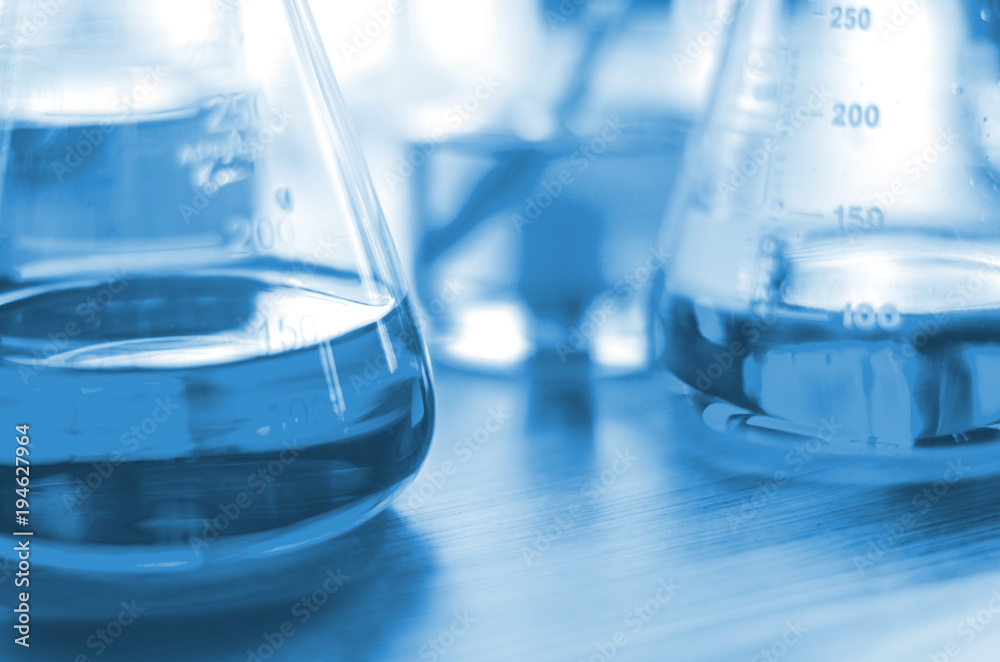 three erlenmeyer flask , Glassware on science laboratory research and development three erlenmeyer flask , Glassware on science laboratory research and development