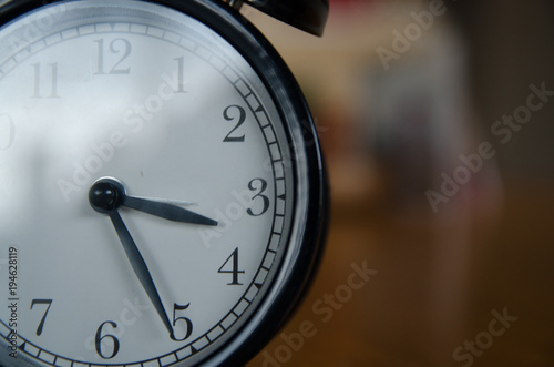 Retro alarm clock on wood table