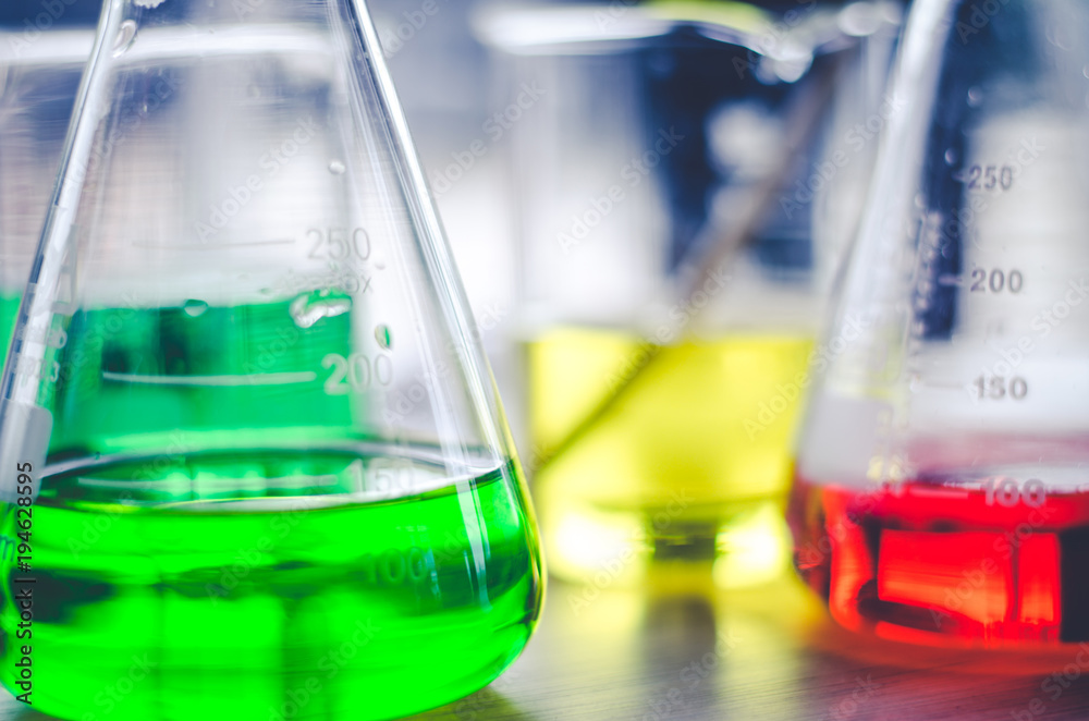 three erlenmeyer flask , Glassware on science laboratory research and development three erlenmeyer flask , Glassware on science laboratory research and development