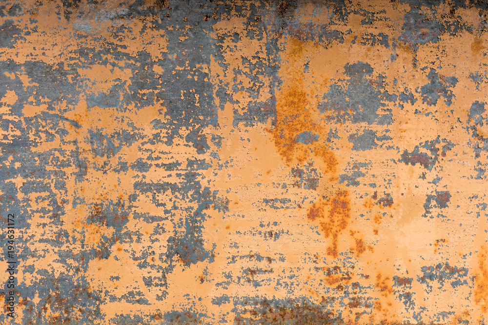 Textured background of a faded yellow paint with rusted cracks on rusted metal. Grunge texture of an old cracked metal surface. Rusty yellow-red stains Textured background of a faded yellow paint with rusted cracks on rusted metal. Grunge texture of an old cracked metal surface. Rusty yellow-red stains