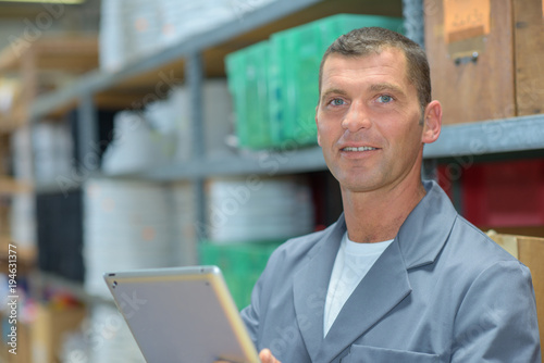Portrait of warehouse worker with tablet
