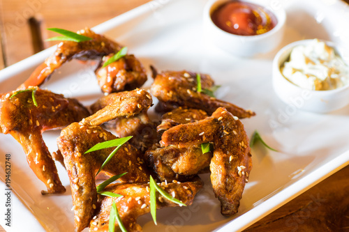 Grilled chicken wings with hot sauce