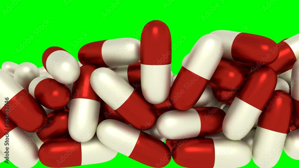 Animated white and red capsule pills falling and tumbling toward camera filling up container against green background and in slow motion Animated white and red capsule pills falling and tumbling toward camera filling up container against green background and in slow motion