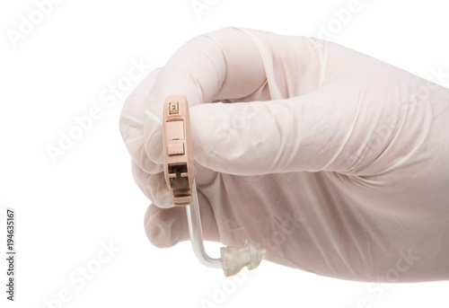 a hearing aid in the doctor's hand photo