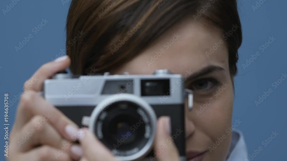 Woman shooting with her digital camera Woman shooting with her digital camera