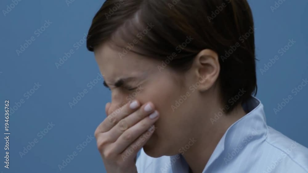 Woman sneezing and having a cold Woman sneezing and having a cold