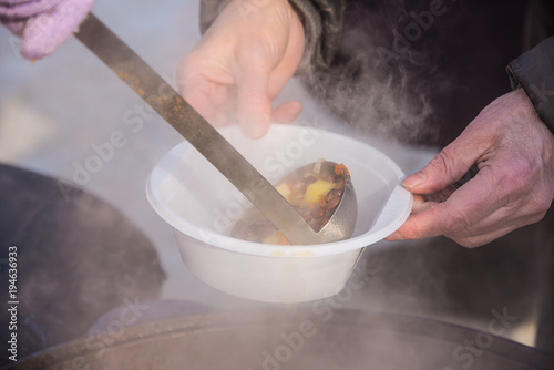 feeding homeless people on the street