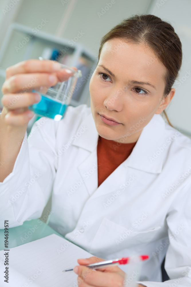 beautiful woman scientist performing experiments beautiful woman scientist performing experiments