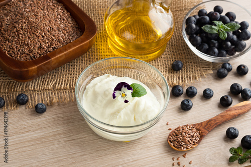 Cottage cheese with flax seed oil, flax seeds and blueberries photo