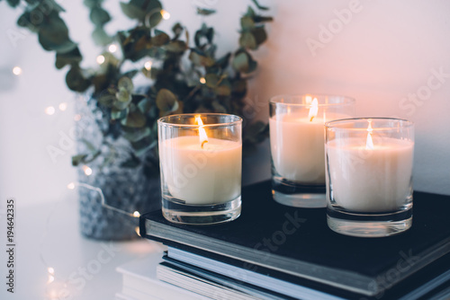 Cozy home interior decor, burning candles photo